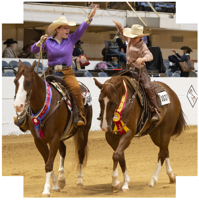 Two IRHA contestants high five in the arena.